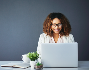 Studio shot of a young businesswoman against a blue background